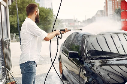 Cleaning car wheel with pressure washer